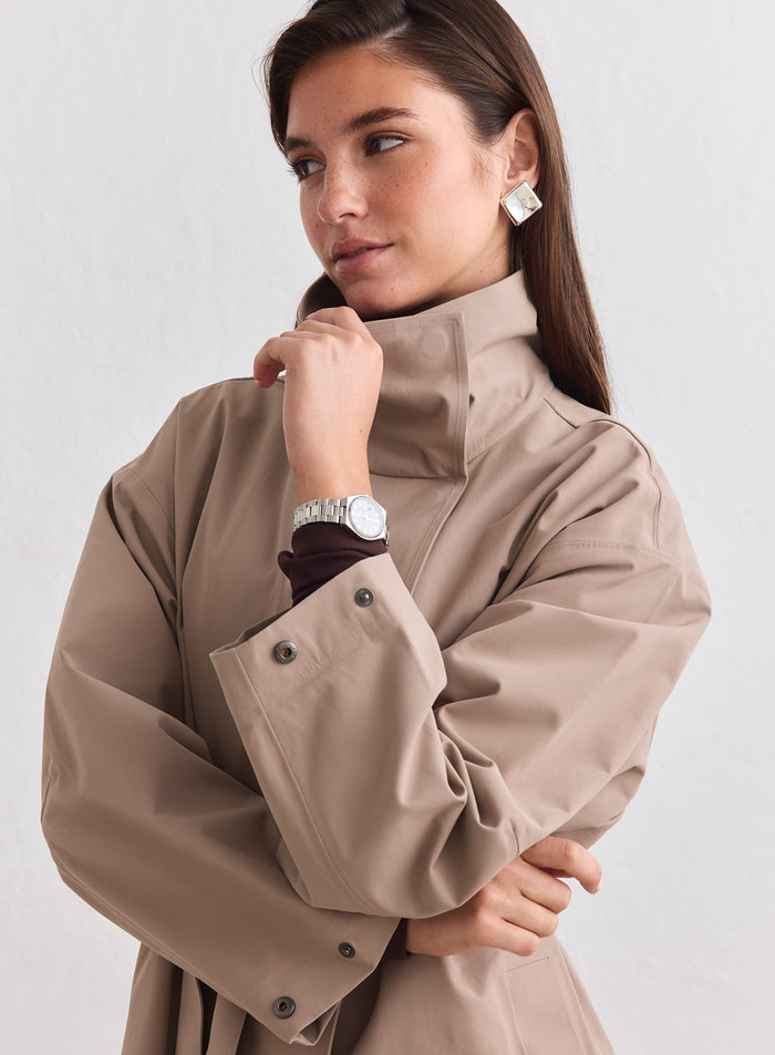 Beige aim'n Waterproof Coat featuring a structured high collar and relaxed silhouette. [M-178cm]