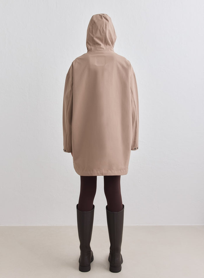 Back view of a model wearing the Espresso Waterproof Oversized Anorak with hood up [M-178cm]
