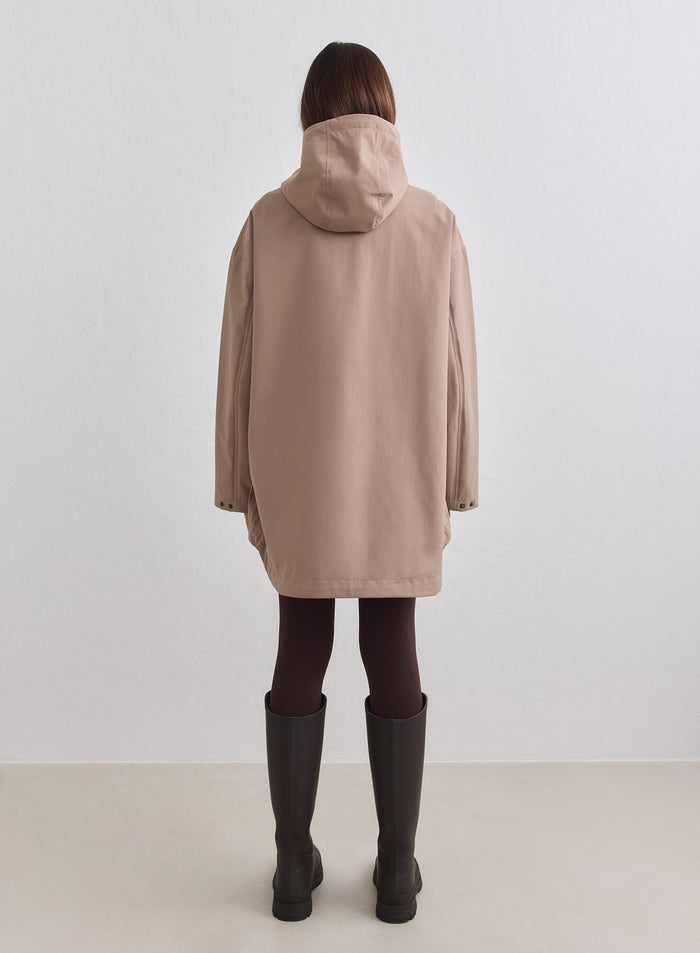 Back view of a model wearing the Waterproof Oversized Anorak in espresso [M-178cm]