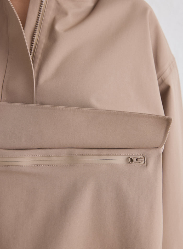 Close-up of the front pocket and zipper detail on the Espresso Waterproof Oversized Anorak from aim'n [M-174cm]