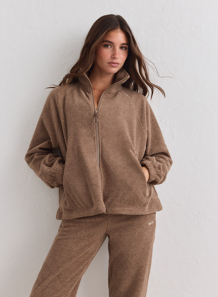 Hazelnut brown aim'n fleece zip jacket featuring a high collar and soft texture. [XS-178CM]
