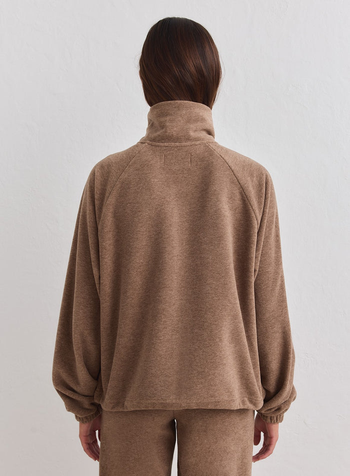 Back view of a hazelnut brown fleece zip jacket with a high collar by aim'n. [xs-178cm]