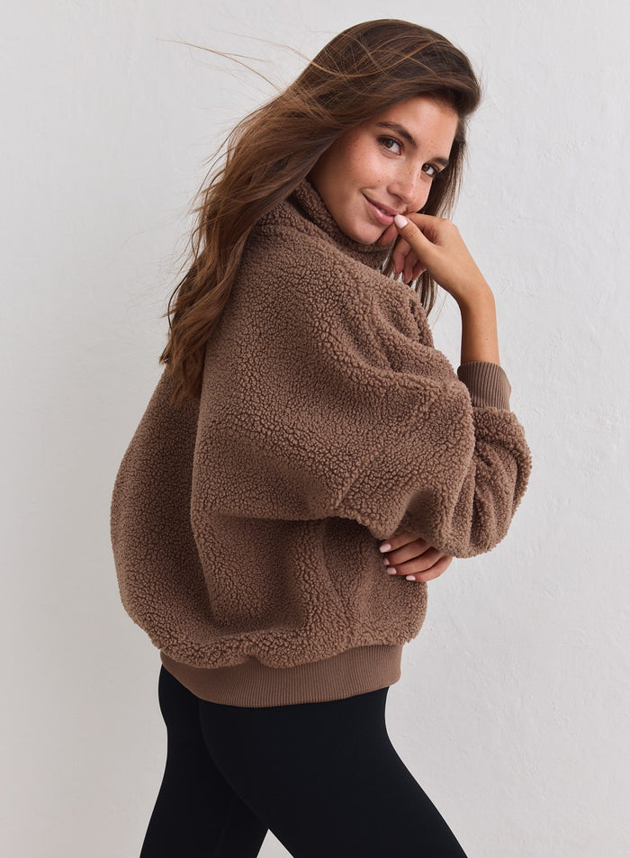 Hazelnut brown Pile Half Zip sweater with a cozy sherpa texture worn by a model. [XS-178CM]