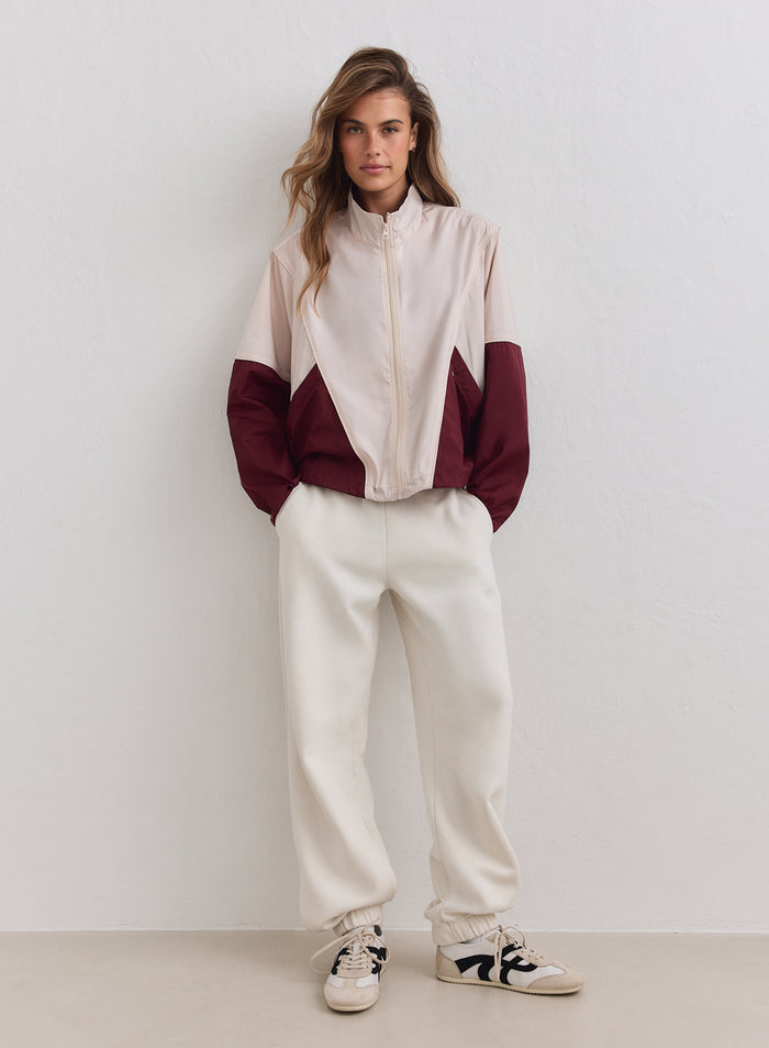 Merlot and beige Balance Windstopper Tracksuit Jacket by aim'n, featuring a loose fit and color-blocking.