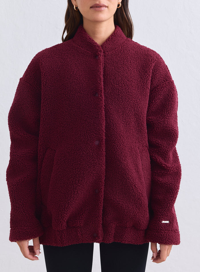 Soft merlot pile coach jacket by aim'n with a relaxed fit and snap-button closure. [S-165cm]
