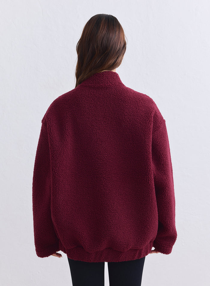 Merlot aim'n pile coach jacket shown from the back with a cozy teddy texture. [S-165cm]