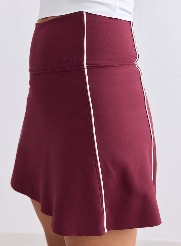Merlot Sense Contrast Skort with white vertical piping and a high-waisted fit by aim'n. [XS-165cm]