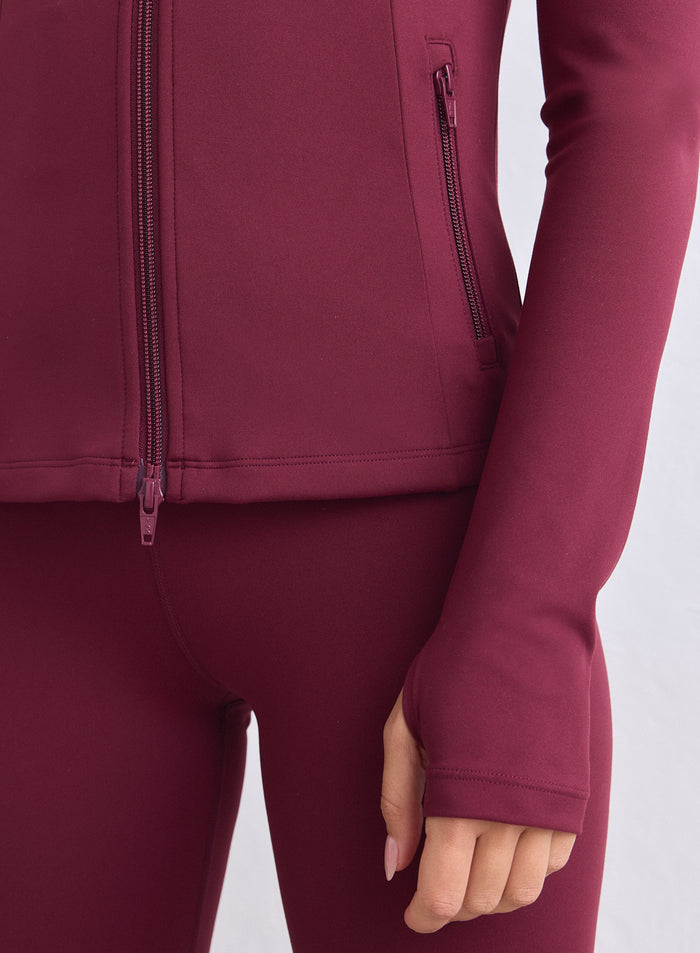Merlot aim'n Sense Zip Jacket in second skin fabric with a two-way zip and thumbholes. [XS-165cm]