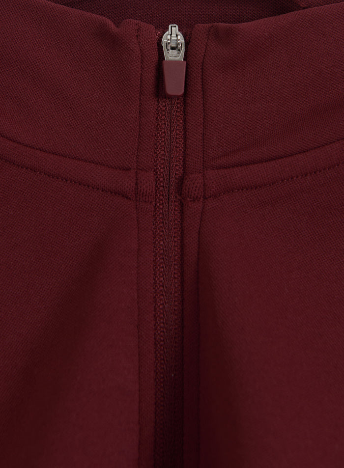 Merlot Shape Seamless Zip Jacket from aim'n featuring a close-up of the front zipper and textured fabric.