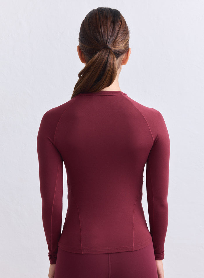 Merlot aim'n Soft Basic Long Sleeve with a second skin feel and raglan sleeves shown from the back. [S-165cm]