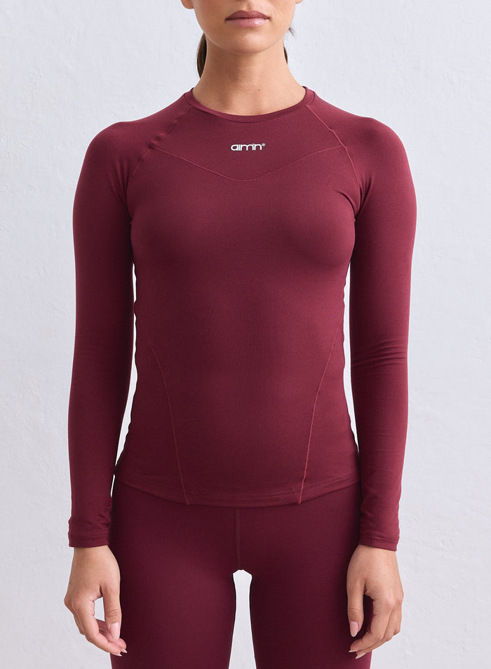 Merlot Soft Basic Long Sleeve by aim'n featuring raglan sleeves and a small chest logo. [S-165cm]