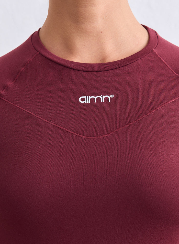 Merlot red Soft Basic Long Sleeve with a white aim'n logo, raglan sleeves, and shaping pintuck detail. [S-165cm]