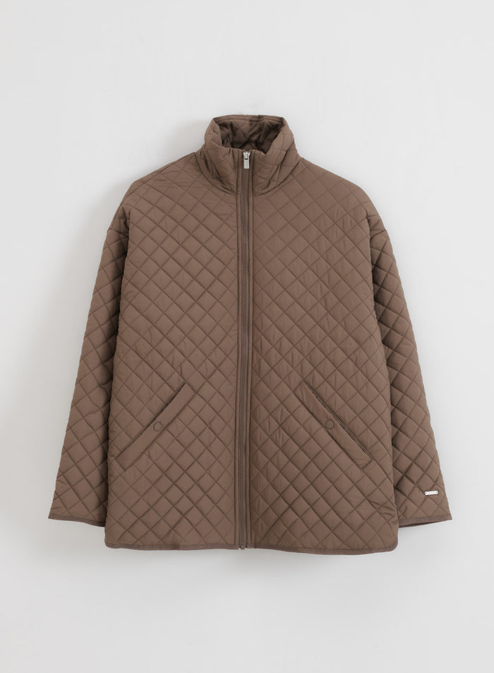 Nougat oversized quilted jacket by aim'n featuring a stand collar and full front zip.