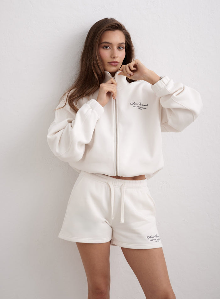 Off-white Script Sweat Shorts worn with a matching zip-up jacket by aim'n. [XS-174cm]