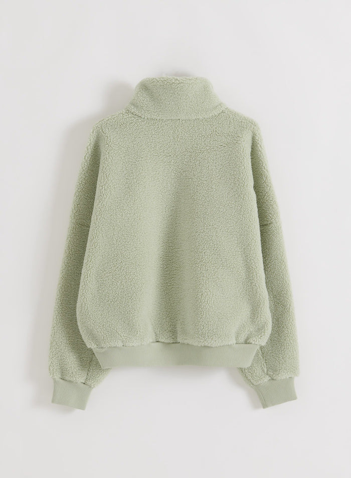 Pistachio Pile Half Zip seen from the back in flatlay view