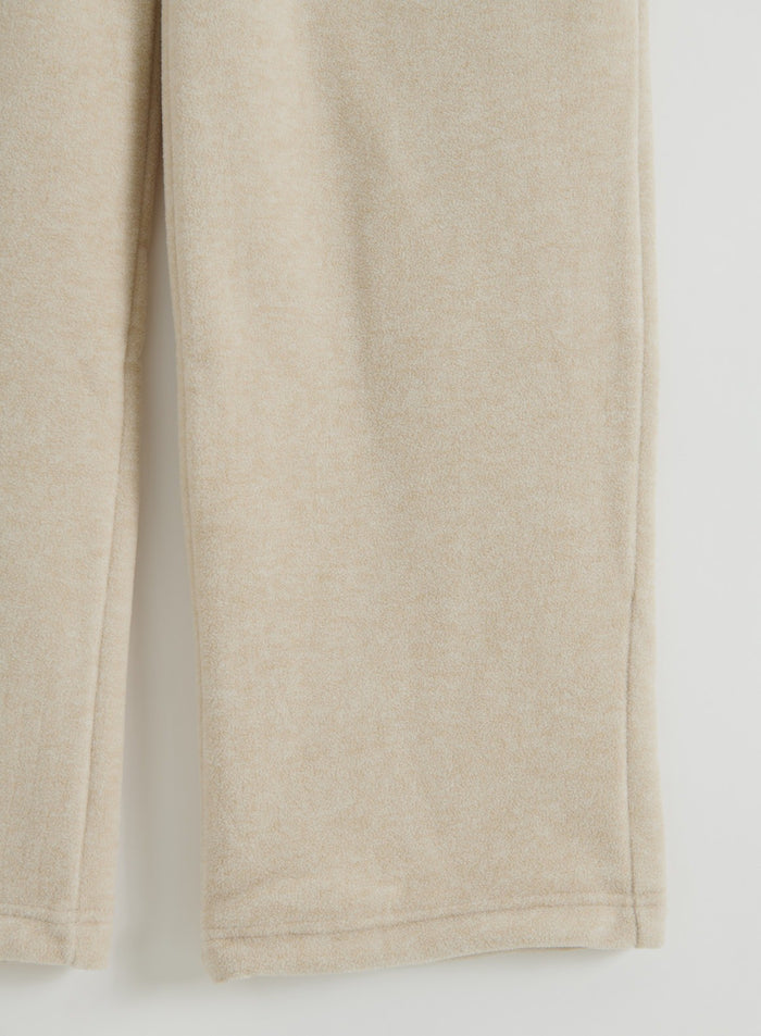Close-up of Sand Fleece Pants in a flatlay view