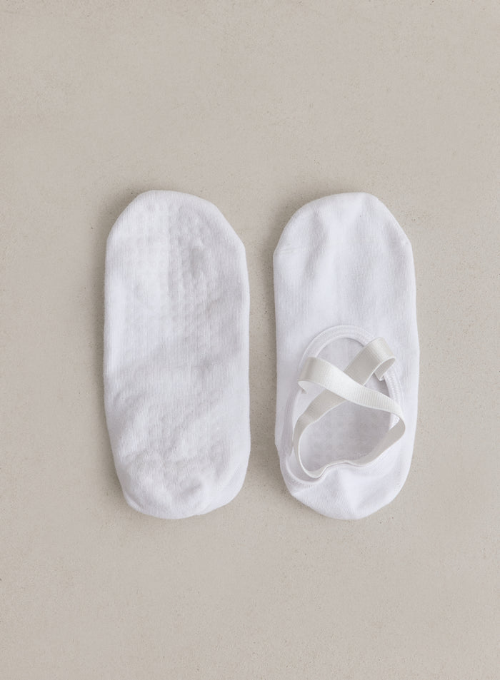 White Pilates Socks from aim'n with criss-cross straps and grip soles