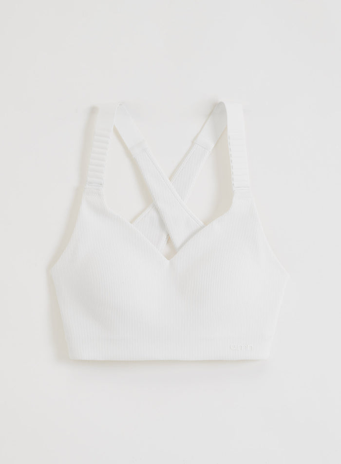White Ribbed Performance Support Bra featuring high-support cross-back straps and a V-neckline in a flatlay.