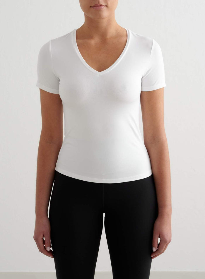 White Soft Basic V-neck Short Sleeve top featuring a tight fit and functional moisture-wicking fabric by aim'n.