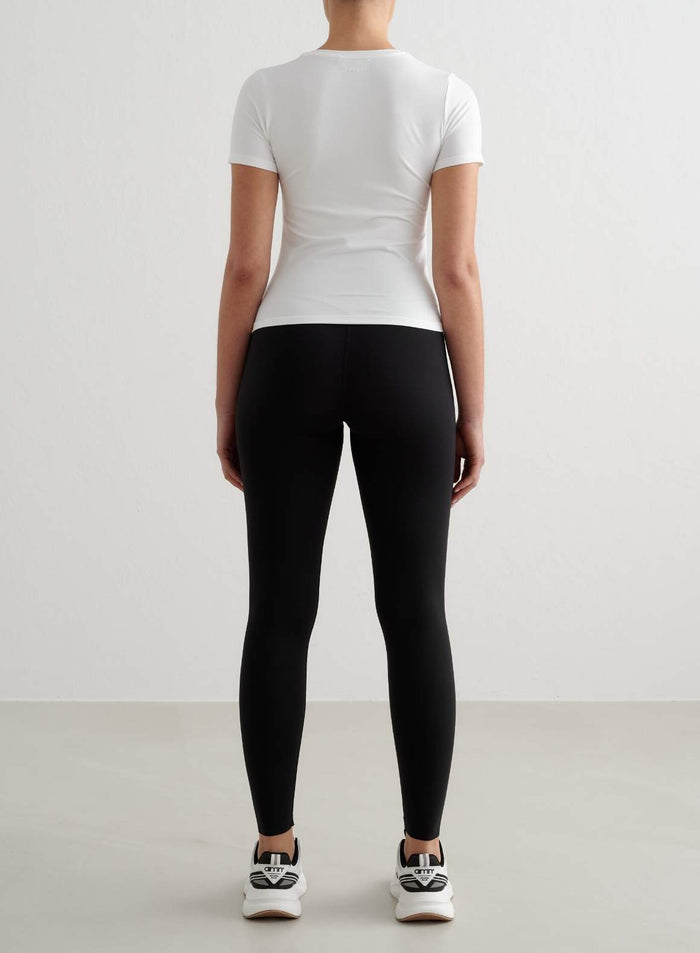 White Soft Basic V-neck Short Sleeve top in a tight fit shown from the back by aim'n.
